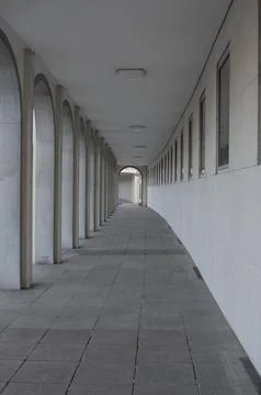 Empty arched gallery with corridor perspective Stock Photos