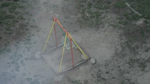 An Empty Area Of The Swings Swinging Stock Footage 125921723