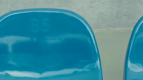 Empty arena stadium seats with blue and yellow plastic seats. Stock Footage 202244870