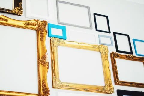 Empty art frames on gallery wall, decor and design Stock Photos