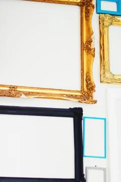 Empty art frames on gallery wall, decor and design Stock Photos