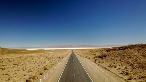 Empty asphalt highway on arid landscape STEADY AERIAL SHOT Stock Footage 88417050