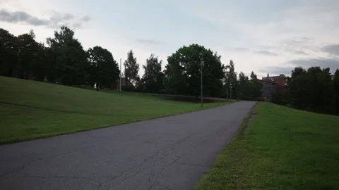 Empty Asphalt Path Climbing Through Urban Lawn at Dusk, Oslo Suburb Stock Footage 344196104
