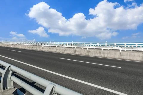 Empty asphalt road and beautiful sky cloud landscape. Stock Photos