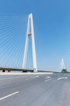 Empty asphalt road and cable-stayed bridge background Stock Photos