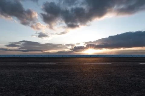The empty Asphalt road and daylight sky and sunshine. 스톡 일러스트