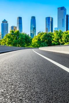 Empty asphalt road and modern cityscape in Beijing,China. Stock Photos