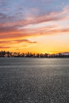 Empty asphalt road and mountain scenery at sunrise. Stock Photos