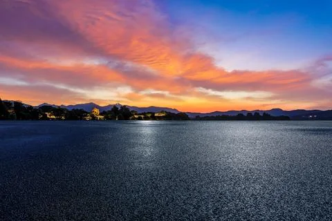 Empty asphalt road and mountain with beautiful sky clouds at sunset. Stock Photos