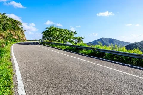 Empty asphalt road and mountain natural scenery Stock Photos