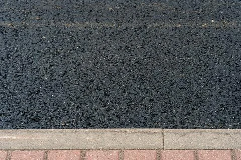 Empty asphalt road close-up against the sky. Empty background, space for text Stock Photos