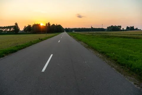 Empty asphalt road close-up against the sky. Empty background, space for text Stock Photos