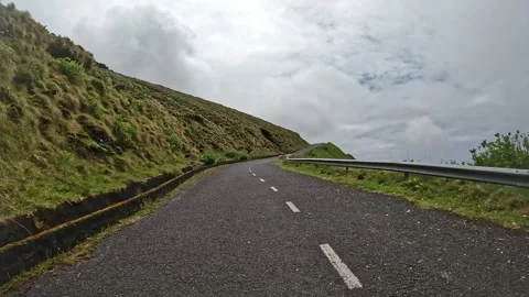 Empty Asphalt Road Curving Uphill in Lush Highlands, Flores Island, Azores Stockbeeldmateriaal 336746467