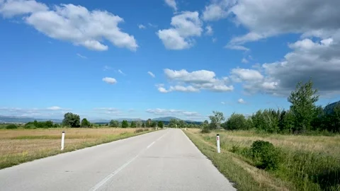 Empty asphalt road in the field at summer. Traveling with a car, driver view. Stock Footage 201999977