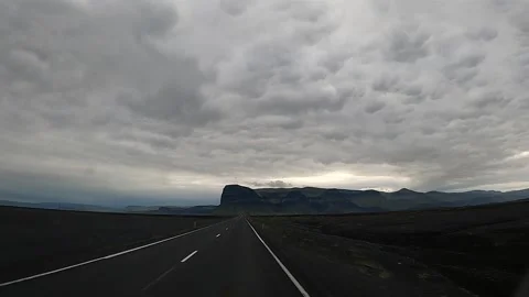 Empty asphalt road leading to mountains in South Iceland, 4K Stock-Footage 334235674
