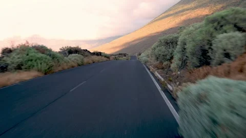 Empty asphalt road with marks and clouds over mountain top in daylight Stock Footage 269338929