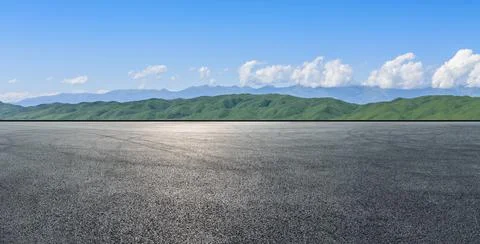 Empty asphalt road mountain under blue sky. Stock Photos