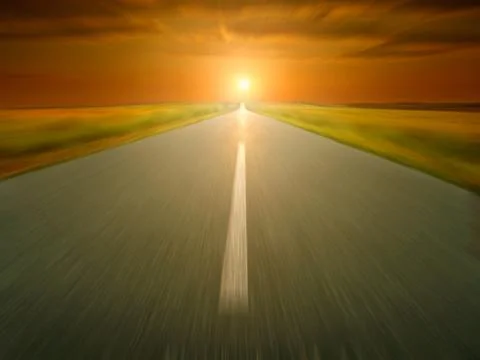 Empty asphalt road at sunset in motion blur Stock Photos