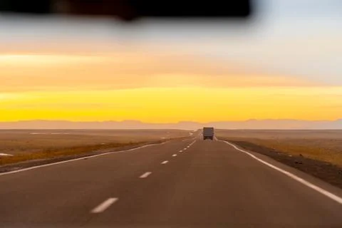 Empty asphalt road at sunset Stock Photos