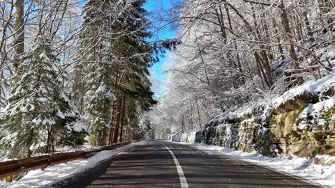 Empty asphalt winter mountain road. Beautiful winter landscape Stock Footage 262567243