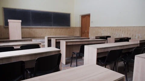 Empty auditorium, classroom, lecture hall which need of repair. Walls faded Stock Footage 72699902