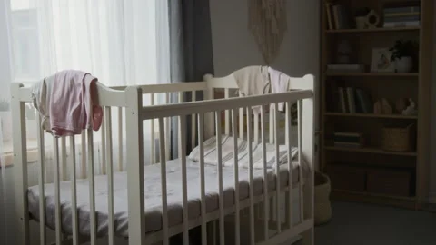 Empty Baby Crib Standing in Nursery Prepared for Newborn Arrival Vídeos de archivo 346594836