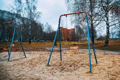Empty baby swing Stock Photos