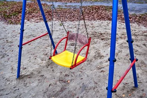 Empty baby swing Stock Photos