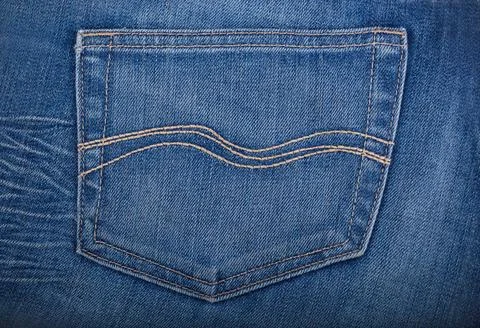 Empty back pocket of blue jeans Empty back pocket of blue jeans. Denim tex... 스톡 사진