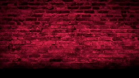 Empty background of an old brick wall, neon light. Dark room with brick walls. Stock Photos