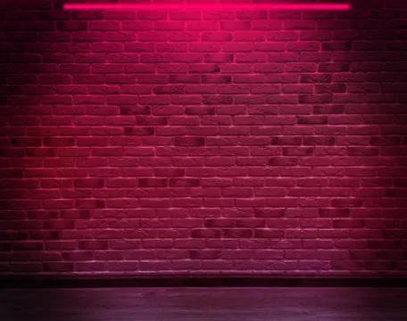 Empty background of an old brick wall, neon light. Dark room with brick walls. Stock Photos