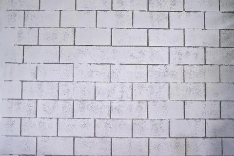 Empty background, uneven white brick wall in rustic room Stock Photos