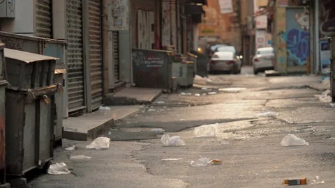 Empty backstreet with trash or garbage on the ground, street with no people Stock Footage 219286126