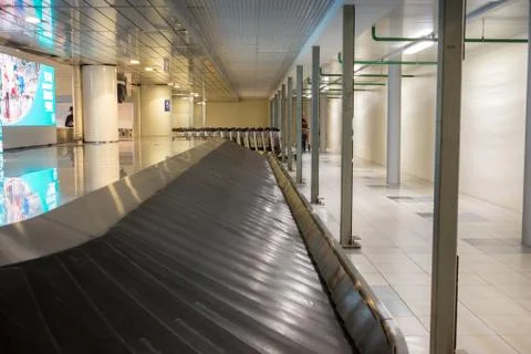 Empty baggage carousel in airport hall Stock Photos