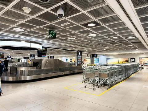 Empty baggage carousel and trolley area at Dublin, Ireland airport arrivals.. Stock Photos