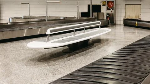 Empty baggage claim area with modern bench Stock-Fotos