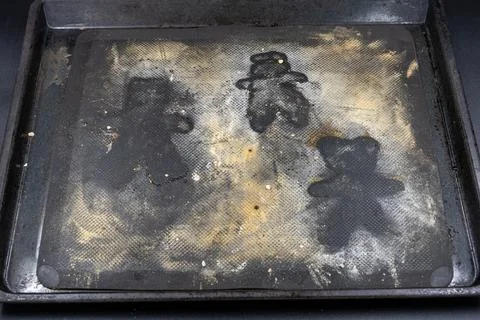 Empty baking sheet with shape of Grittibnz. Stock Photos