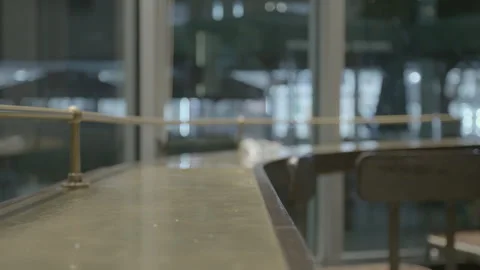 Empty Bar Counter with Blurred Pedestrians at Night Stock-Footage 343877371