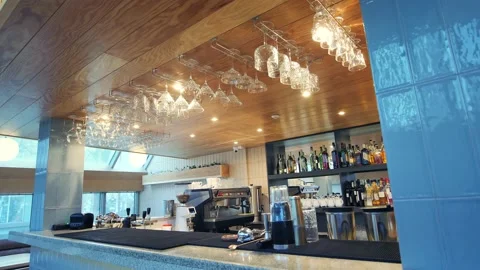 An empty bar counter with bottles in the background in a restaurant, bar or Stock Footage 172405430