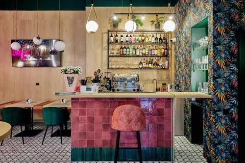 Empty bar with different alcohol drinks and wooden counter Stock Photos