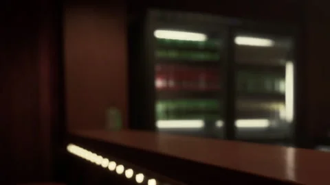 Empty bar with shelves of drinks in the background during evening hours Stock Footage 344162074