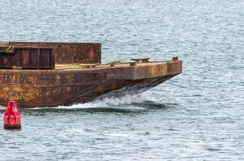 Empty barge heading into port Stock Photos