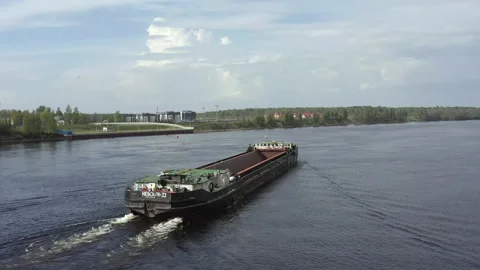 An empty barge for transporting timber or sand floats down the river Stock-Footage 155184705