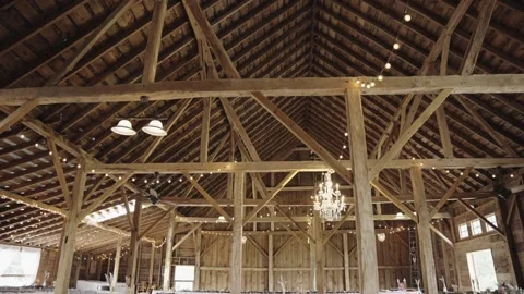 Empty barn wedding venue for ceremony, white banquet dinner tables set 스톡 동영상 228902149