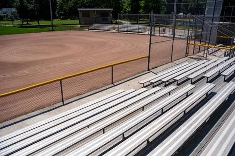 Empty baseball diamond viewed from stadium bleachers Stock Photos