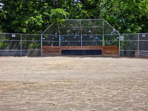Empty Baseball Field Backstop and Dirt Infield at Community Sports Park Stock Photos