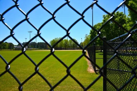 Empty Baseball Field Closed during Coronavirus Pandemic Stock Photos