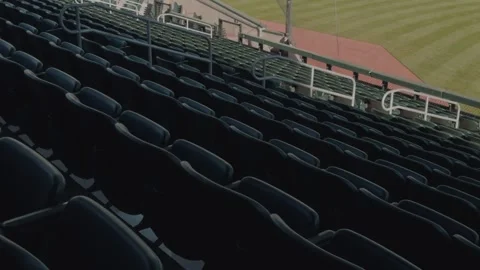 Empty baseball stadium seating and outfield in slow steady left to right pan 库存影片 332633286