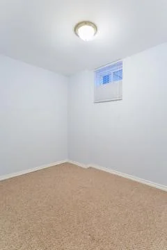Empty basement bedroom Stock Photos