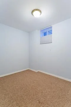 Empty basement bedroom Stock Photos